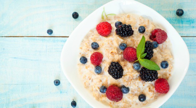 Healthy breakfast - oatmeal with blackberries, blueberries and raspberries